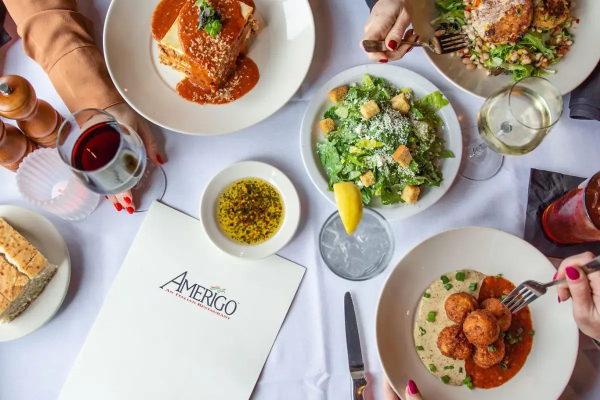 Amerigo Italian Restaurant interior with elegant lighting and patio seating, perfect for date nights near The Jessam